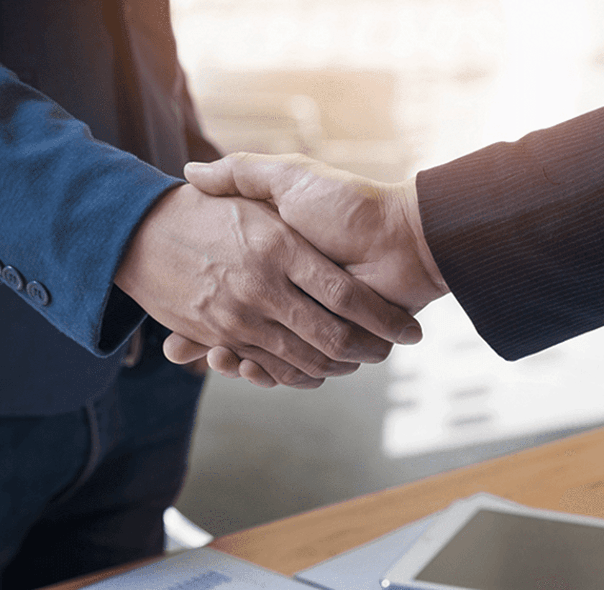 Two business professionals shaking hands