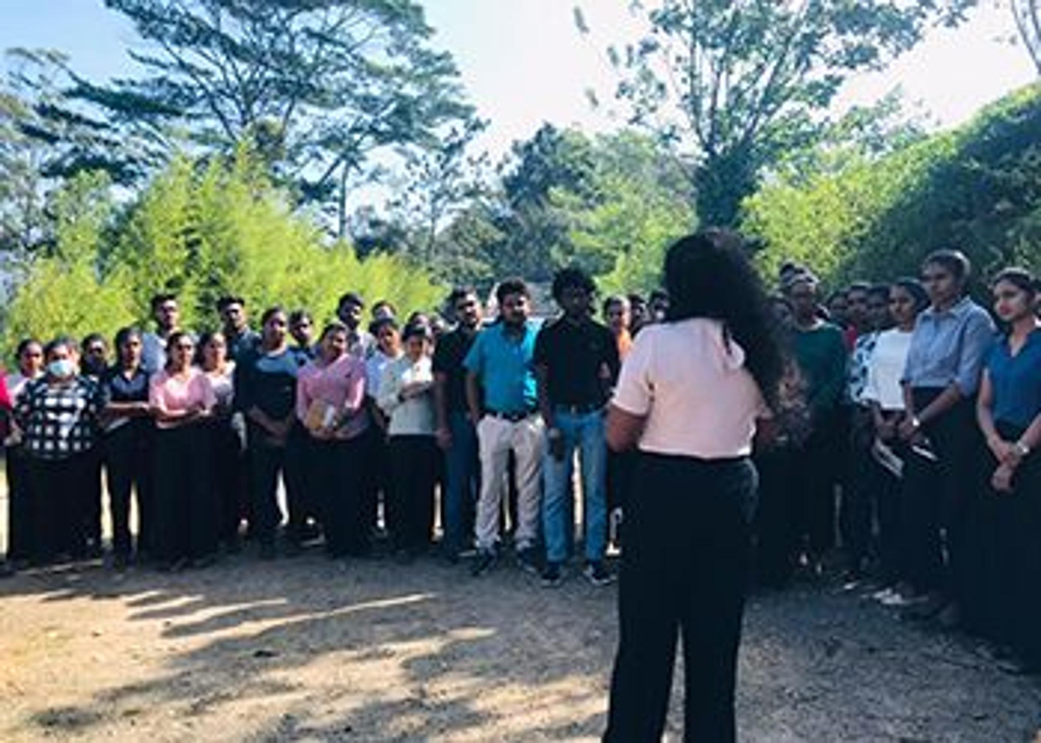 University students gathered outdoors for a training